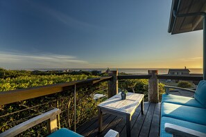 Front deck with panoramic ocean views and comfortable outdoor seating