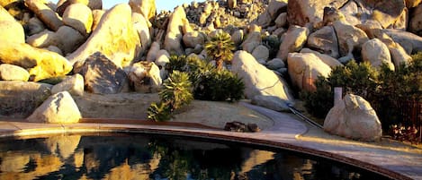 Salt water pool.Joshua Tree park boundary is adjacent to our boulders. 
