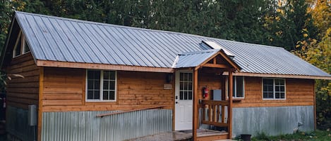 Cabin exterior featuring accessible ramp