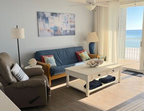 Comfortable seating in living room looking right out at the beach