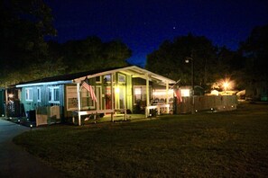 Night time lighted view of the Front of house