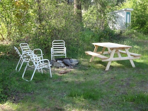 Two picnic tables one great firepit and a whack of firewood