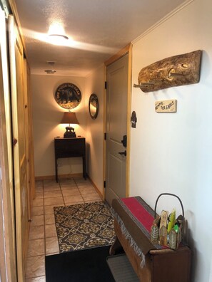 Entrance and looking towards hallway that leads to guest & master bedrooms