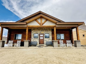 Cabin Front...bin located to the left of the front door have yard games inside