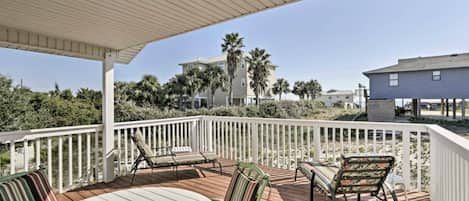 look out at the gulf of mexico from a partially covered deck 