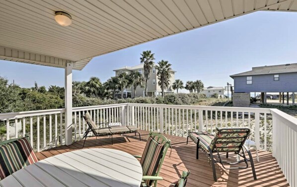 look out at the gulf of mexico from a partially covered deck 