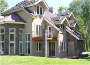 Side view of  house - deck located by Master bedroom