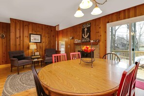 Vintage knotty pine gives the room a warm and cozy feeling. Beachy cottage!
