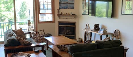 Living area with sliding glass door to front deck.