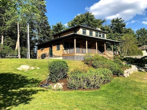 View of cottage and lawn