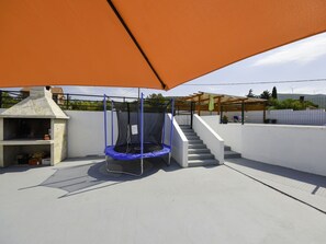 Building, Shade, Outdoor Furniture, House, Roof, Tent, Tints And Shades, Chair, Sky, Composite Material