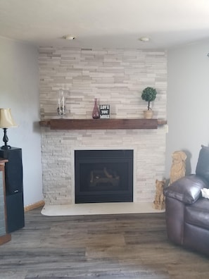 Natural stone gas fireplace in Living room