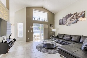 Modern furnishings throughout and tile floors everywhere but the bedrooms.