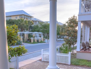 View of walkover from front porch - white structure to right of golden columns