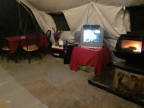 woodstove keeps things cozy...we have bundles of firewood you can buy or forage 