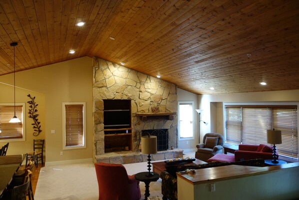 Spacious great room with sitting area adjoining kitchen and dining room. 