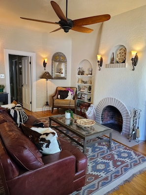 Living area exudes old world charm with cozy niches, coved walls, beehive place