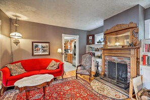 The main house features a wood-burning fireplace in the living room.