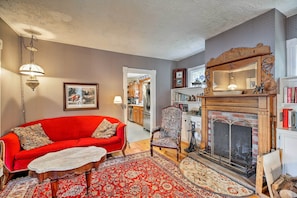 The main house features a wood-burning fireplace in the living room.