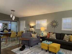 Living Room with ample seating and a 50" TV.