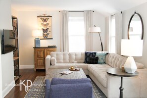 Spacious Living Room with plenty of windows to bring in the sunshine.