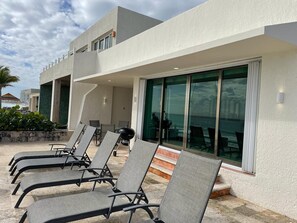 Ocean front Terrace with lounge beds.jpeg