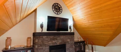 Our hand stained cedar ceilings and cozy fireplace. 