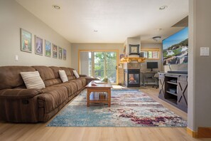 Enjoy the flat screen TV and fireplace