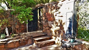 Courtyard outside of kitchen with outdoor grille