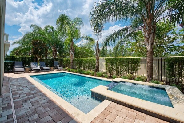 Private Pool & Spa: Refresh and unwind in your private pool and spa, surrounded by lush greenery and comfortable loungers. The perfect setting for sunny Florida days and peaceful evenings under the stars.