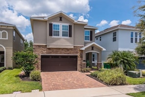 Welcoming Luxury Vacation Home: Arrive at this stunning two-story vacation home, boasting contemporary architecture, beautiful landscaping, and a stylish exterior that invites you to make lasting memories.