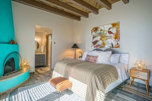 Lower bedroom with Kiva Fireplace