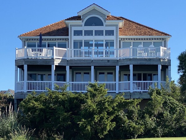 Rear Decks overlooking golf course and expansive waterfront / sunset views.