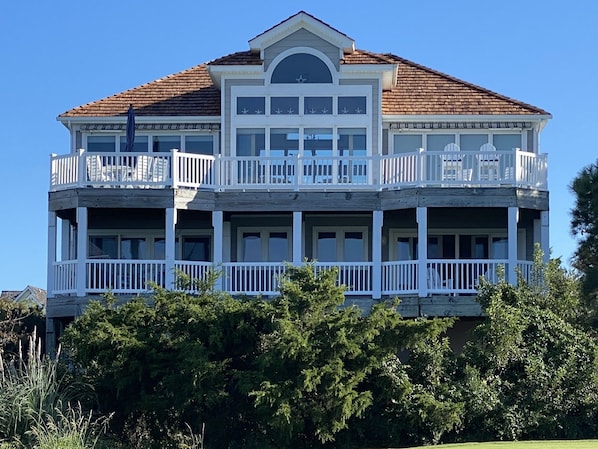 Rear Decks overlooking golf course and expansive waterfront / sunset views.