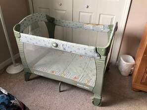 pack and play for guest use, folded away in toy story room closet