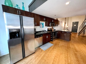 Full kitchen with standard coffee maker.