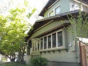 Family/game room windows over-looking  the park across the street.