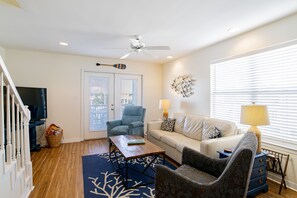 The living room has a 55 inch flat screen. Leather sofa is also a queen sleeper.