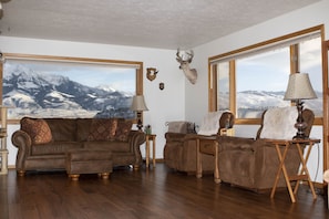 The 180 degree view of the mountains greet you as you enter the living room.