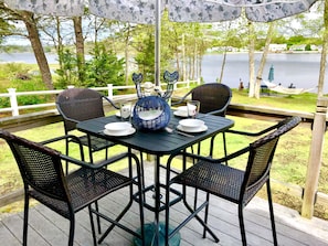Patio table for 4 with umbrella and panoramic views.