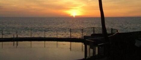 Sunset Over Oceanfront Pool