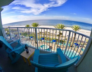 Our 4th floor Balcony overlooking center of pool and 180 degree view of gulf. 🐳