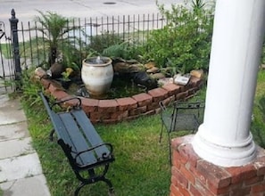 FRONT YARD POND with goldfish and aquatic plants, snails & an occasional frog.  