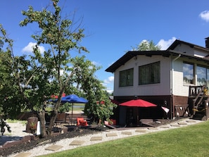 Have a sit on the patio while enjoying a glass of wine under the umbrella.