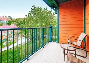 Enjoy views of the  pool area and mountains from your private deck
