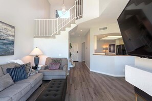 Main living space with view to golf course in background.