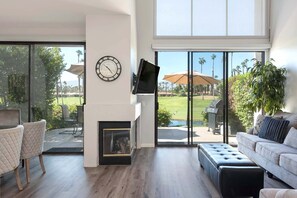 Main living space with view to golf course in background.