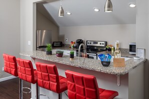 The kitchen has stove,keurig,toaster oven, frig, crockpot, blender, pots & pans.