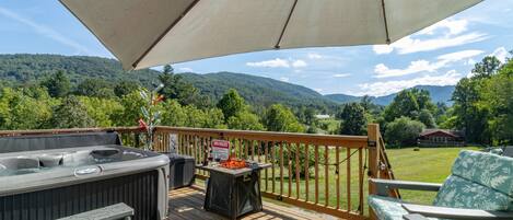 Pop open the umbrella to enjoy beautiful views in the shade on comfy adirondacks