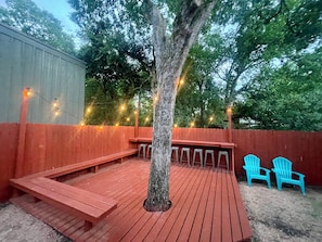 New backyard deck, string lights, bar top seating :)